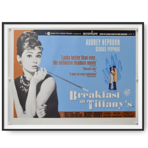 This is framed UK quad poster for a 2001 rerelease of Breakfast at Tiffany's. Audrey Hepburn features prominently in the image.