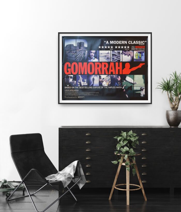 This poster features the word 'Gomorrah' in red letters and features images from the film.