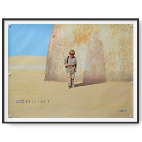 This a framed UK quad poster for the 1999 release of Episode 1 of the Star Wars series. A shadow on the sandstone rock suggest who Anakin Skywalker is set to become.