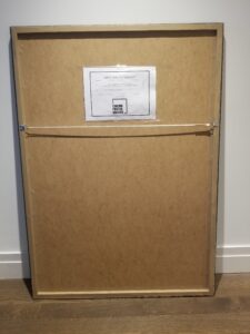 Purpose sealing of a custom framed cinema poster.